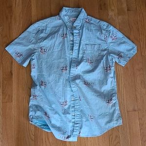 Hawaiian shirt with surfers on it